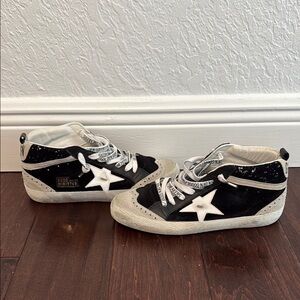 Golden Goose MidstarWomen’s Black and White Sneakers